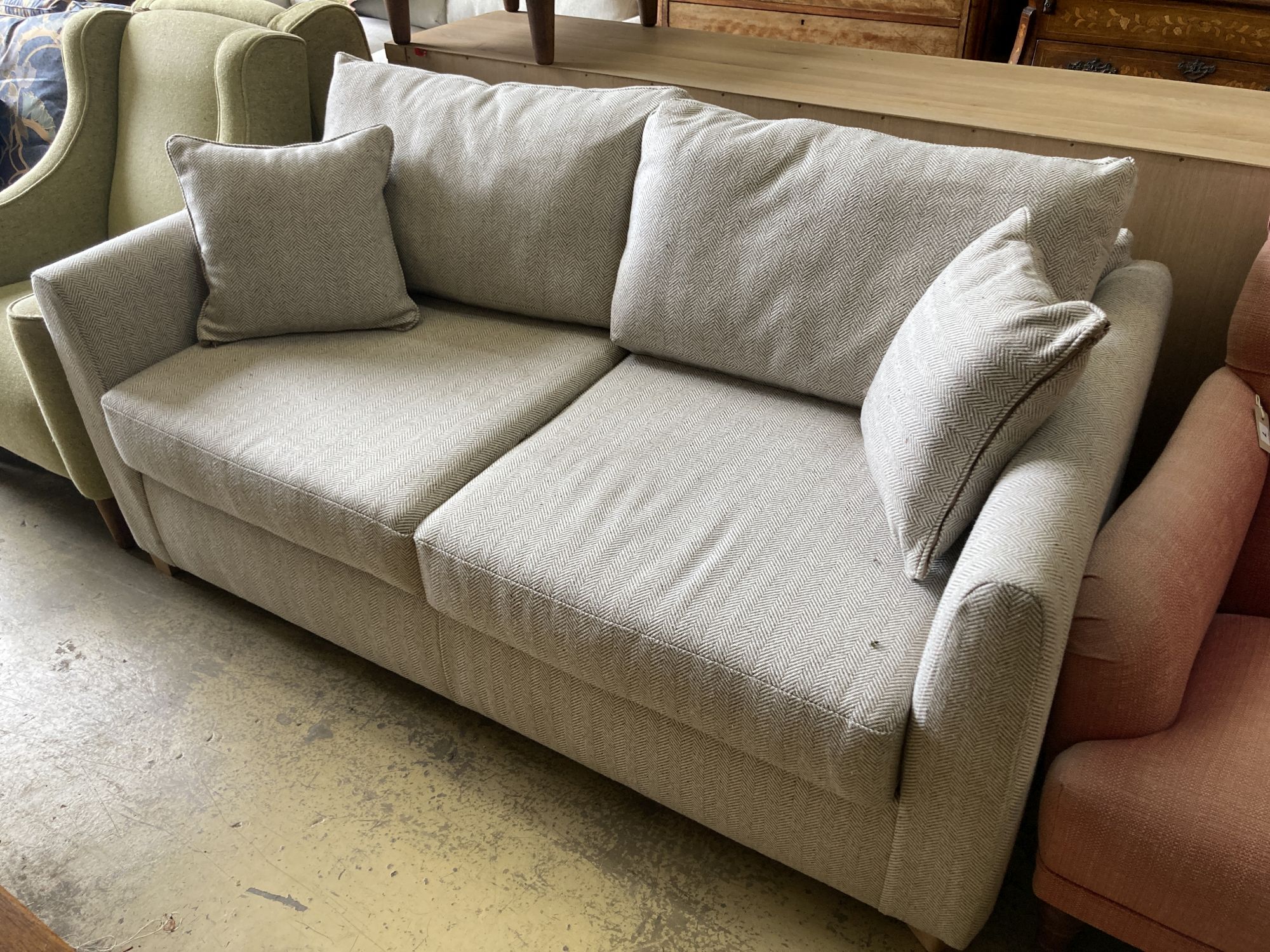 A modern contemporary two-seater sofa bed, length 174cm, width 95cm, height 86cm